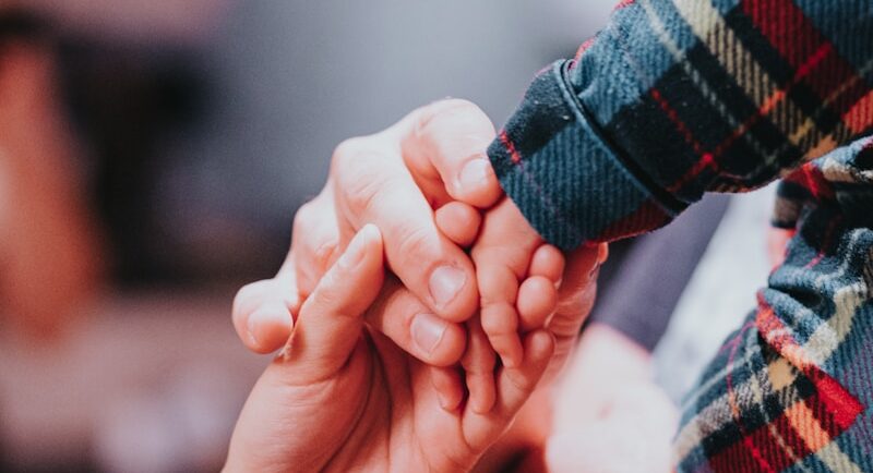 Photo by Marcos Paulo Prado a couple holding hands while holding each other